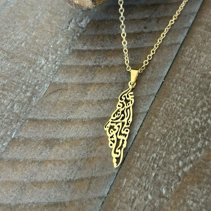 Palestine Map Necklace Engraved with Mahmoud Darwish’s iconic words: “على هذه الأرض ما يستحق الحياة” On this land, there is what deserves life
