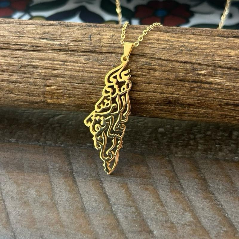 Palestine Map Necklace Engraved with Mahmoud Darwish’s iconic words: “على هذه الأرض ما يستحق الحياة” On this land, there is what deserves life - Wider